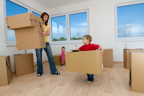 Mover carrying protected furniture through a Bankside apartment building