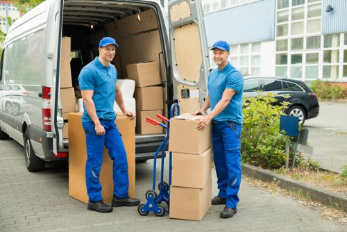 Staff wearing PPE while loading a van safely